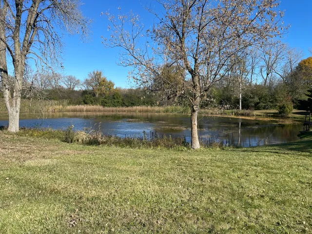 a swimming pool with wooden fence