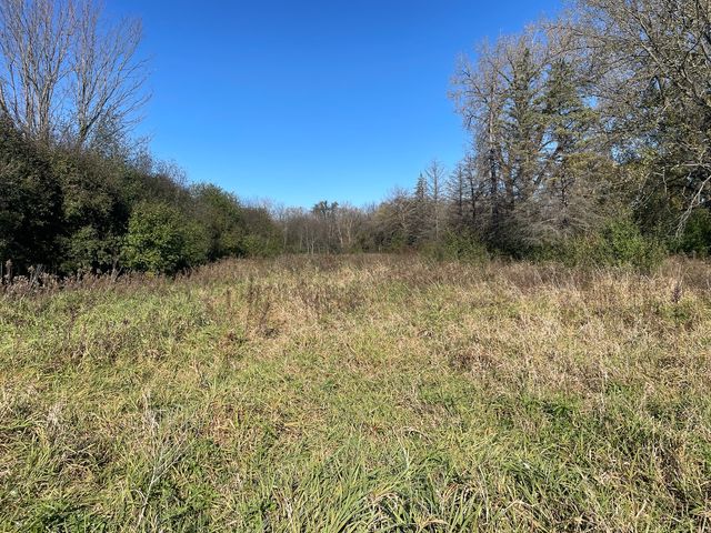 a view of a lake with mountain in the background