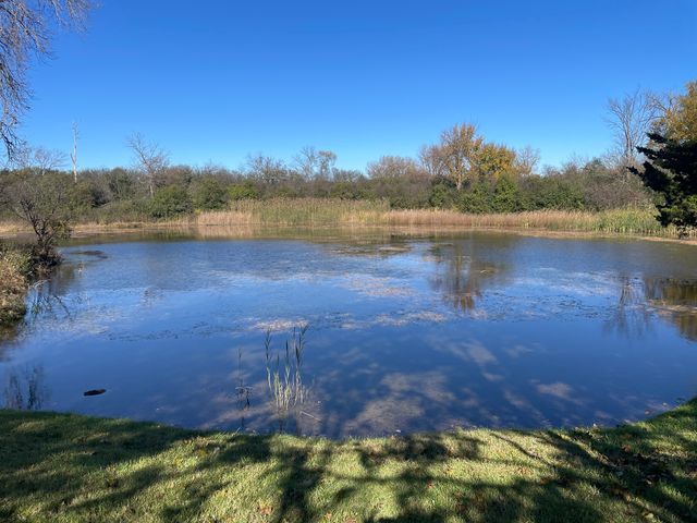 a view of a lake in front of a building