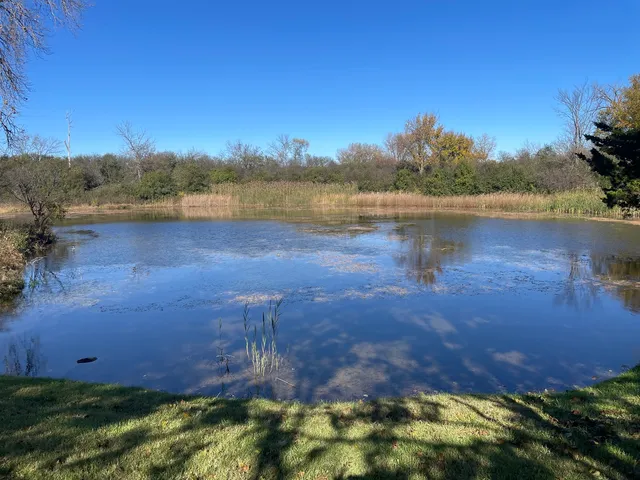 a view of a lake in front of a building