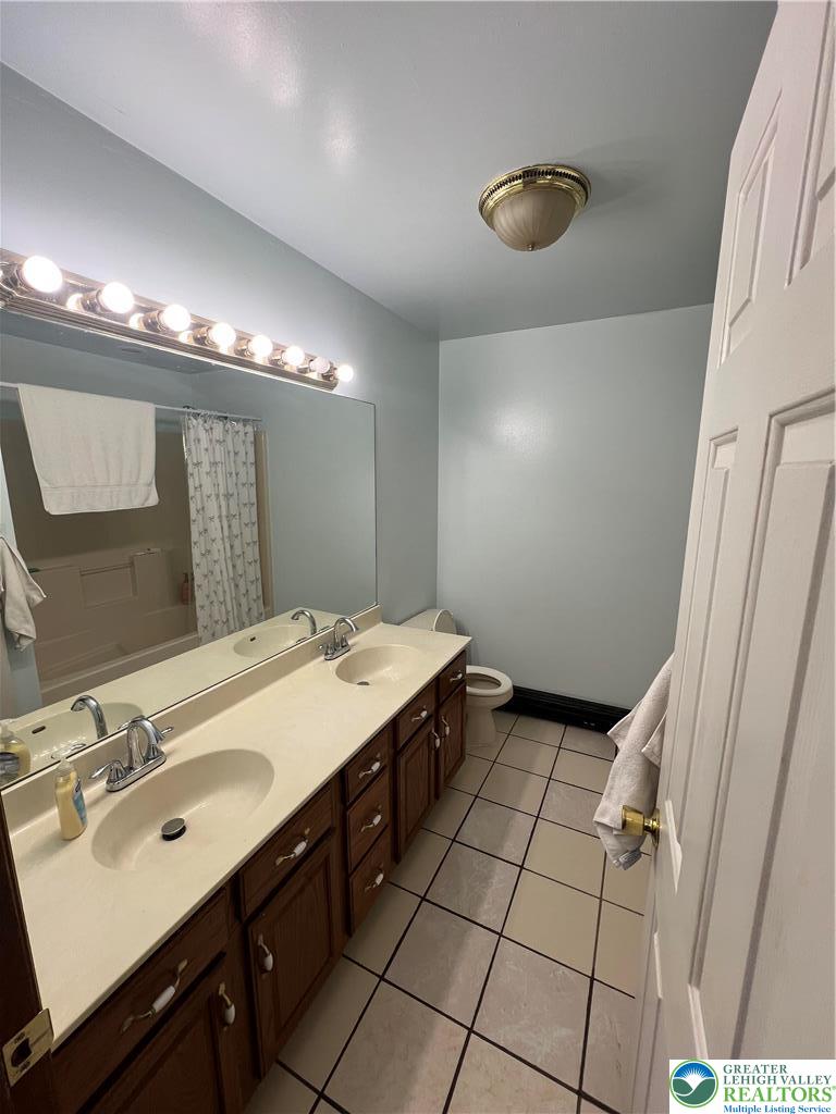 1240 Howeytown Road East Stroudsburg, PA 18302 - Photo 6 of 12 a spacious bathroom with a double vanity sink a mirror and a shower