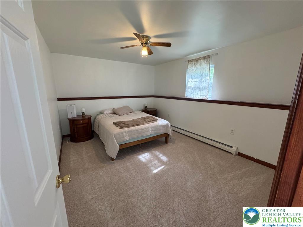 1240 Howeytown Road East Stroudsburg, PA 18302 - Photo 9 of 12 a bedroom with a bed and window