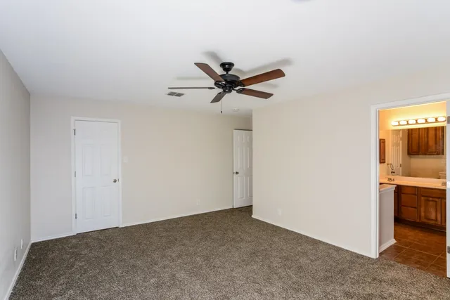 a view of a livingroom with a ceiling fan