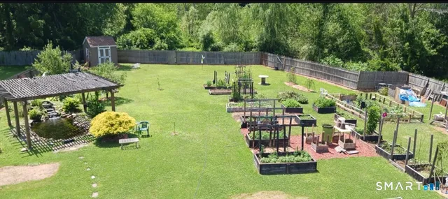 a view of a garden with lawn chairs