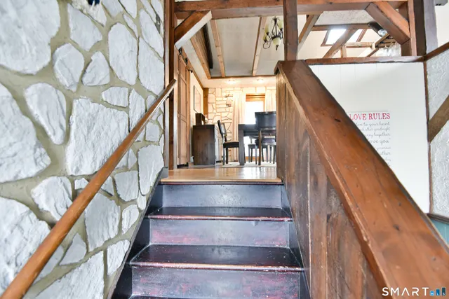 a room with wooden floor and furniture