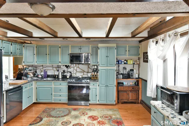 a kitchen with a stove and a sink