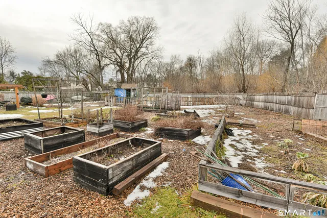 a view of a backyard of the house