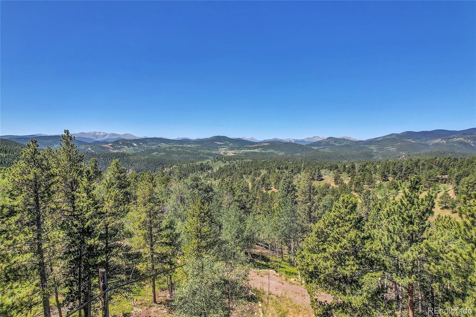 5 Hughesville Road Black Hawk, CO 80422 - Photo 10 of 17 a view of a city with lush green forest