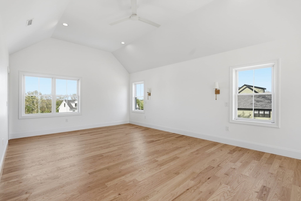 16 Couture Way Middleton, MA 01949 - Photo 18 of 36 an empty room with wooden floor and window