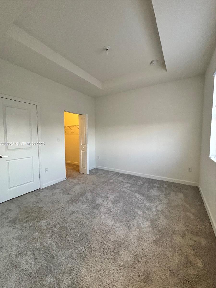 29228 Southwest 163rd Court Homestead, FL 33033 - Photo 11 of 18 an empty room with a empty space and windows