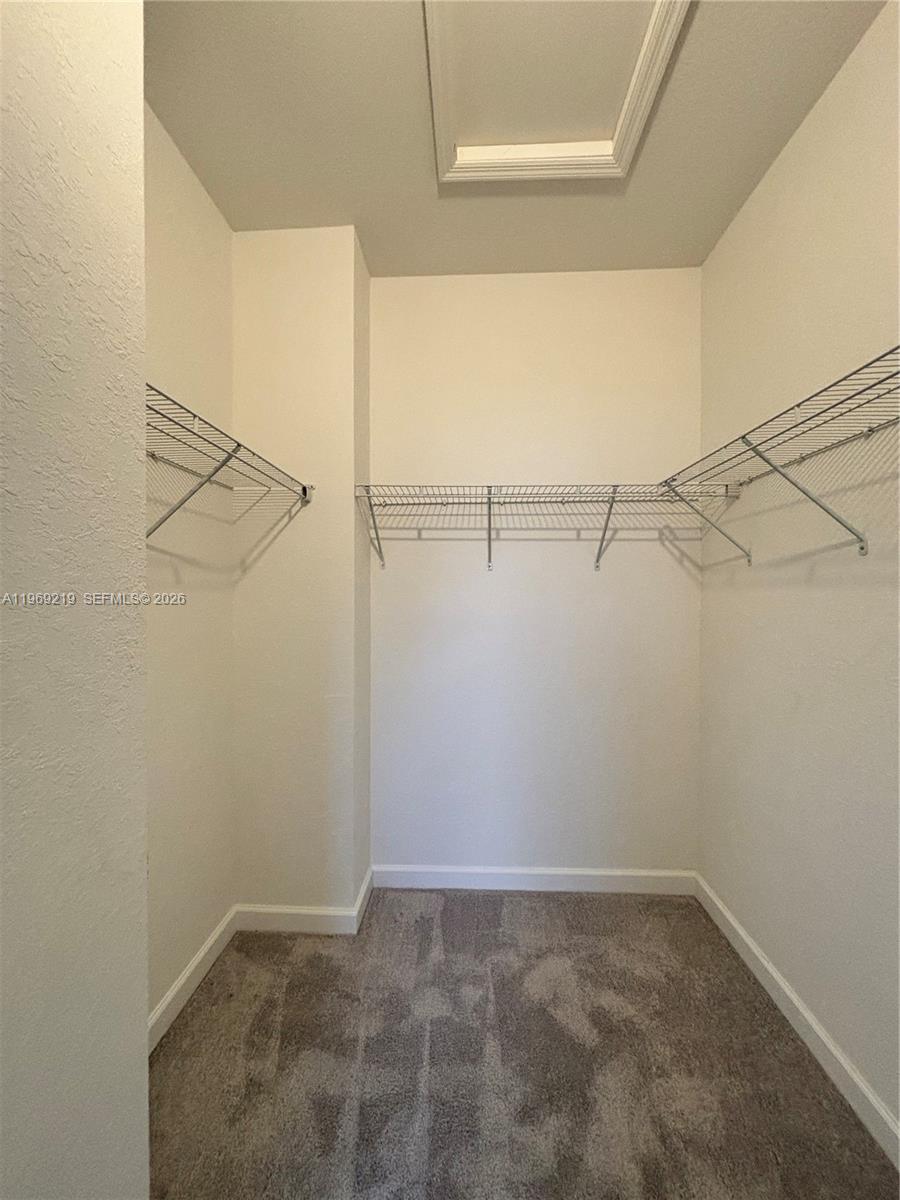 29228 Southwest 163rd Court Homestead, FL 33033 - Photo 12 of 18 a view of a room with racks on the wall