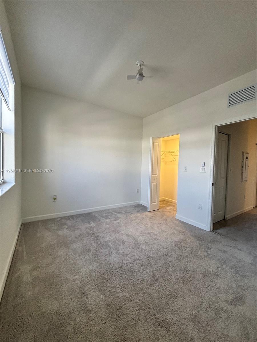 29228 Southwest 163rd Court Homestead, FL 33033 - Photo 14 of 18 an empty room with a empty space and windows
