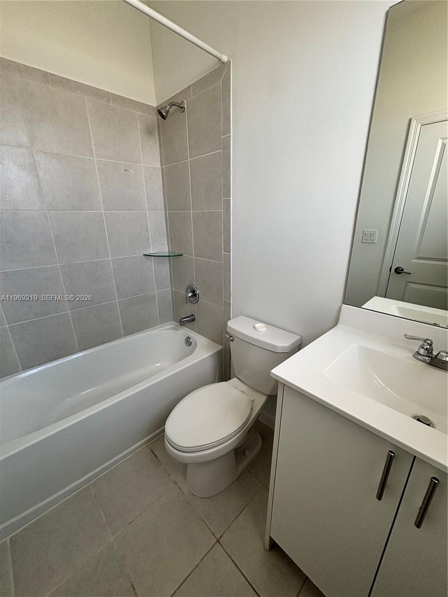 29228 Southwest 163rd Court Homestead, FL 33033 - Photo 15 of 18 a bathroom with a sink toilet and shower