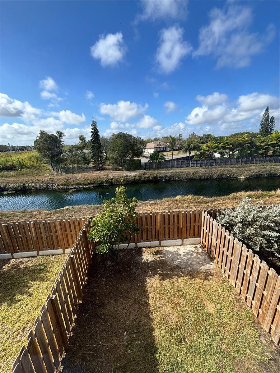 29228 Southwest 163rd Court Homestead, FL 33033 - Photo 16 of 18 a view of a lake with a garden