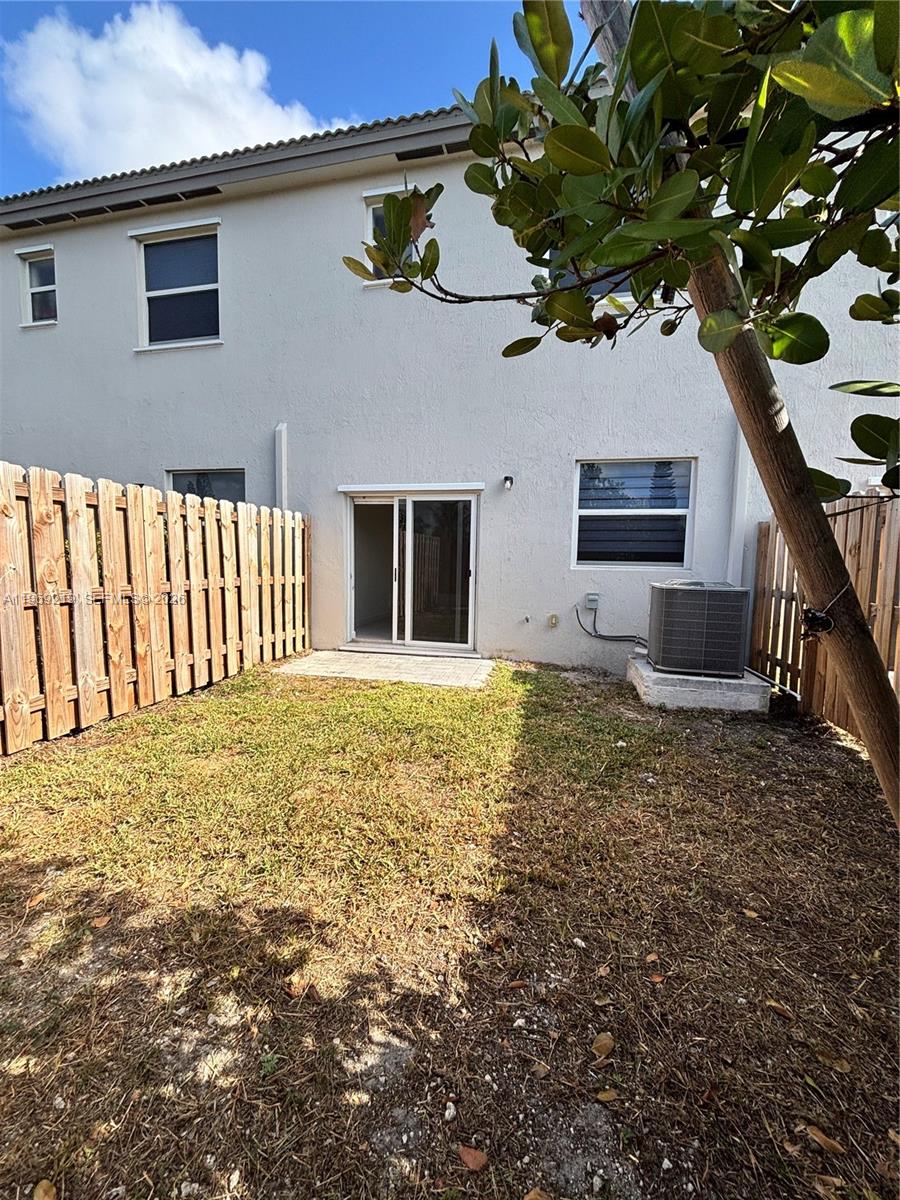 29228 Southwest 163rd Court Homestead, FL 33033 - Photo 17 of 18 a front view of a house with a yard