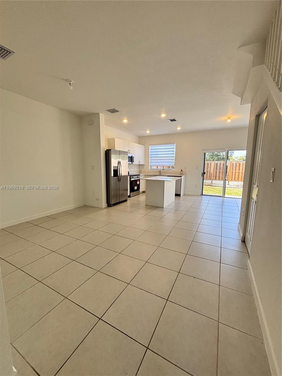 29228 Southwest 163rd Court Homestead, FL 33033 - Photo 3 of 18 a kitchen with stainless steel appliances a sink and counter space