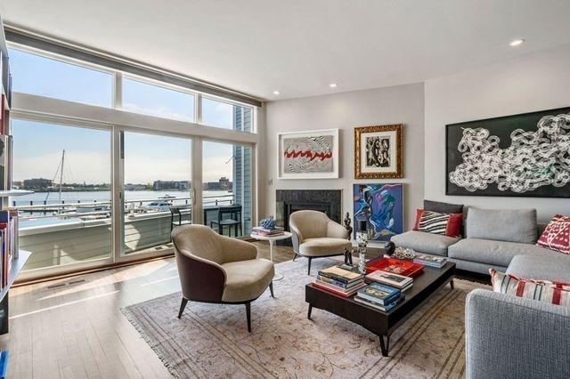 a work room with furniture and a book shelf