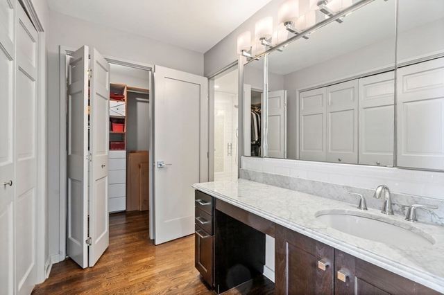 a bedroom with bed and a window