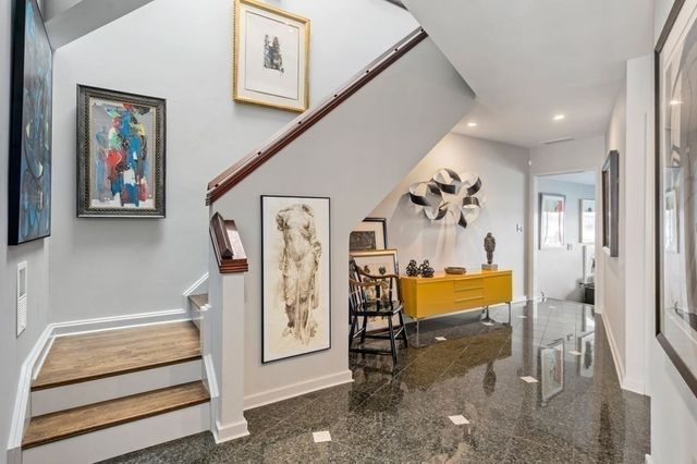 a kitchen with a stove a sink and a refrigerator