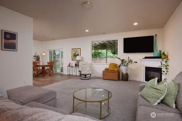 a kitchen with stainless steel appliances granite countertop a stove refrigerator a sink a stove and white cabinets