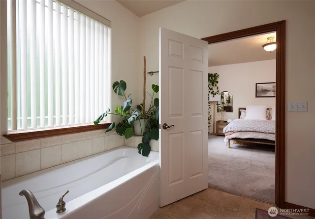 a room with a table and a potted plant