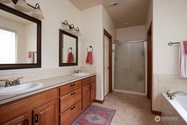 a view of a house with backyard porch and sitting area