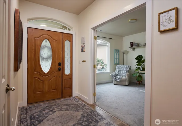 a view of a livingroom with furniture and a potted plant