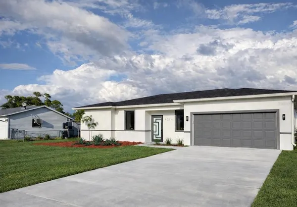 a front view of house with yard and green space