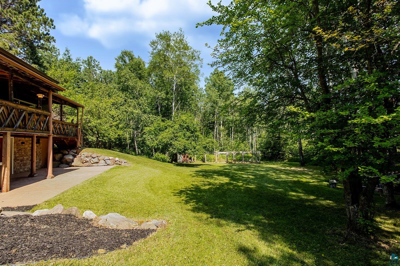29 Ridge Road Esko, MN 55733 - Photo 4 of 41 Expansive lawn area with mature trees and natural landscaping