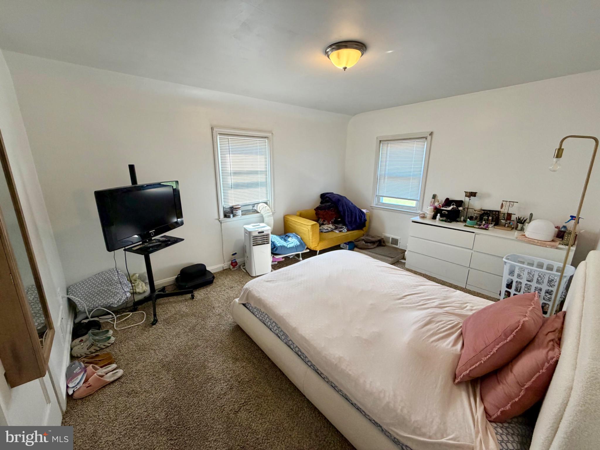 601 Braeside Road Baltimore, MD 21229 - Photo 7 of 19 a bedroom with a bed and furniture