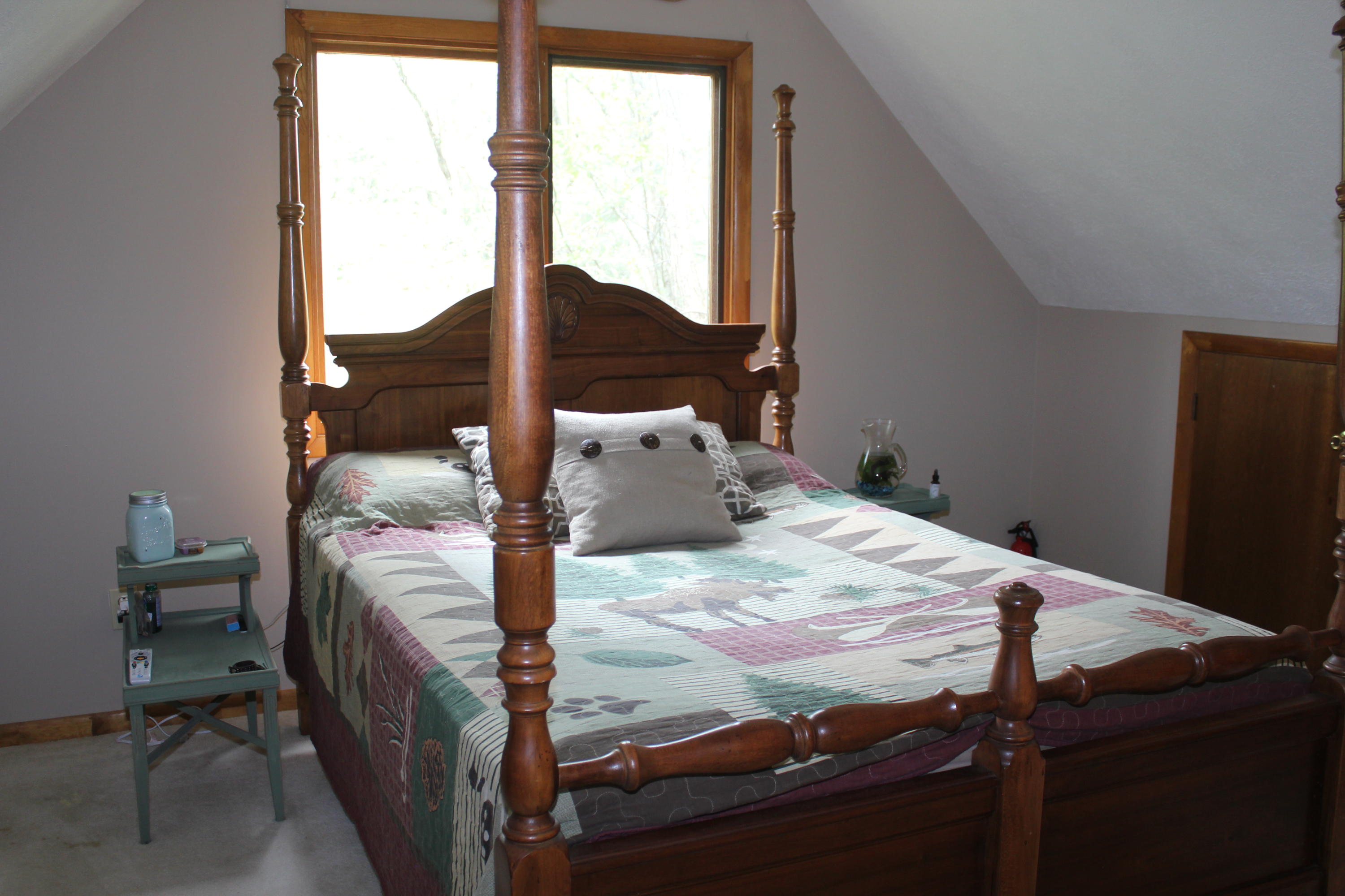 108 Slusher Store Road Northeast Floyd, VA 24091 - Photo 15 of 21 a bed sitting in a bedroom next to a window