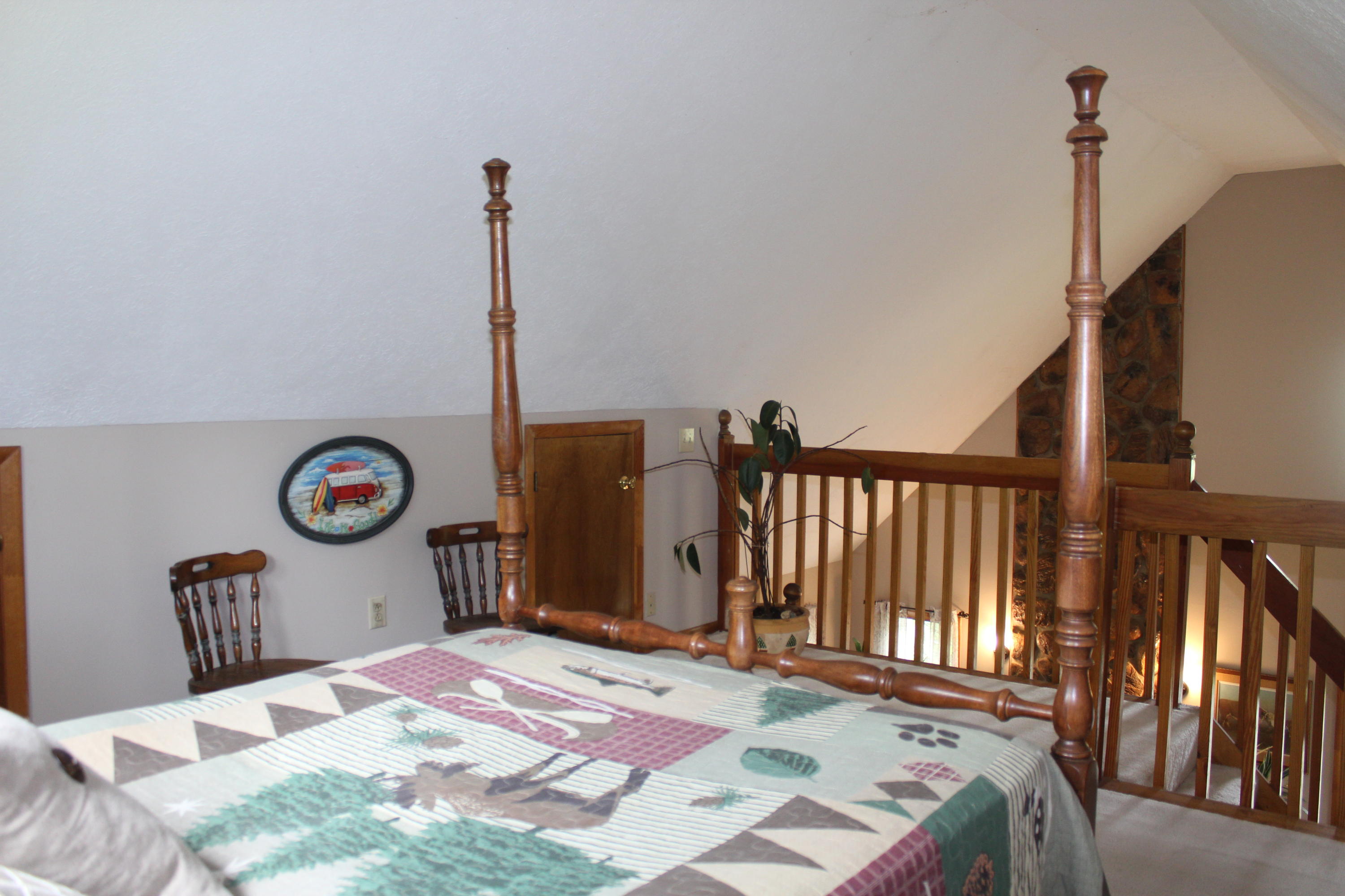 108 Slusher Store Road Northeast Floyd, VA 24091 - Photo 16 of 21 a bedroom with a bed a chandelier and dresser
