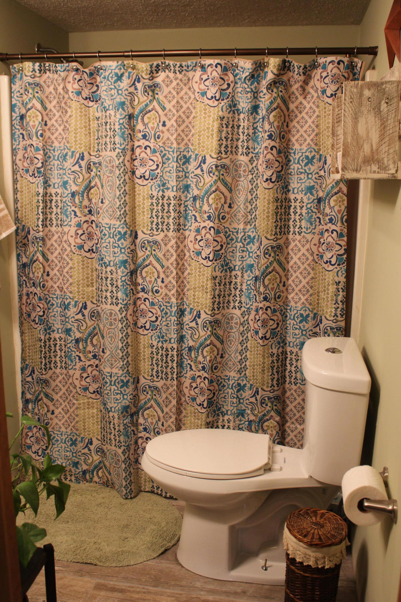 108 Slusher Store Road Northeast Floyd, VA 24091 - Photo 6 of 21 a white toilet sitting next to a shower curtain