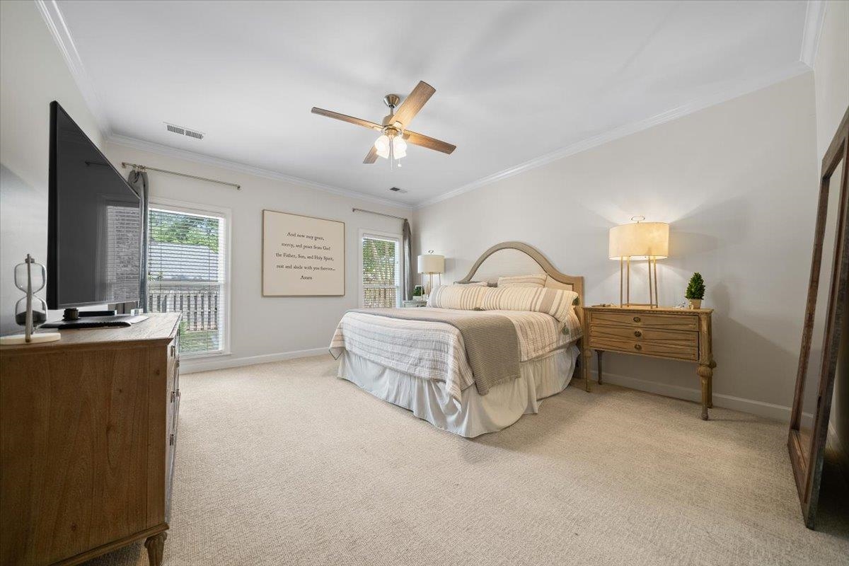 1876 Liles Lane Collierville, TN 38017 - Photo 17 of 36 Bedroom featuring neutral carpeting, crown molding, and a ceiling fan