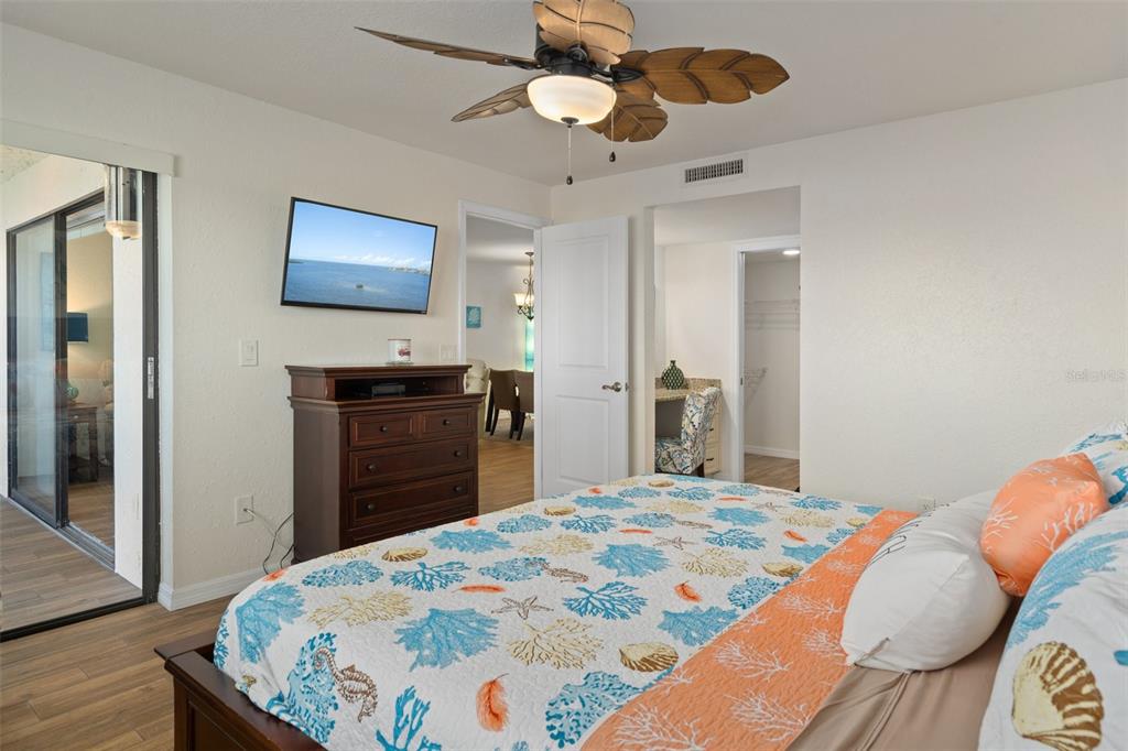 8211 Brent Street, Unit 847 Port Richey, FL 34668 - Photo 22 of 29 a bedroom with a bed and a chandelier