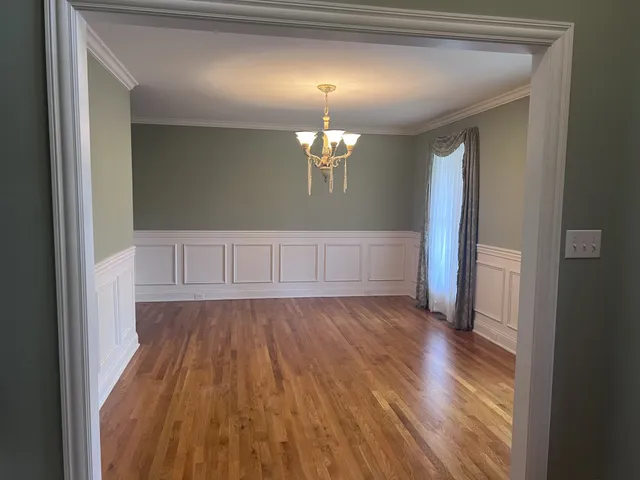 a kitchen with stainless steel appliances granite countertop a refrigerator sink and stove