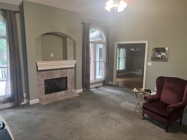 a bath tub sitting in a bathroom next to a window