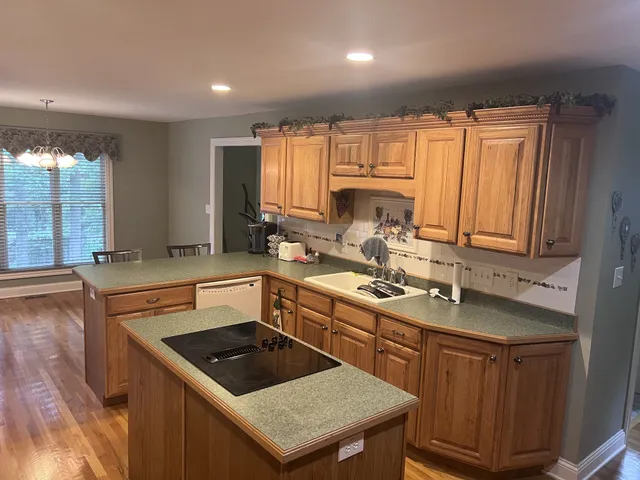 a bathroom with a double vanity sink toilet and shower