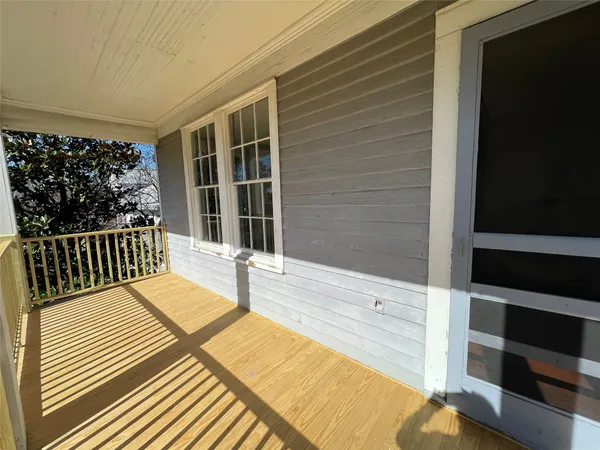 a balcony view with a rug