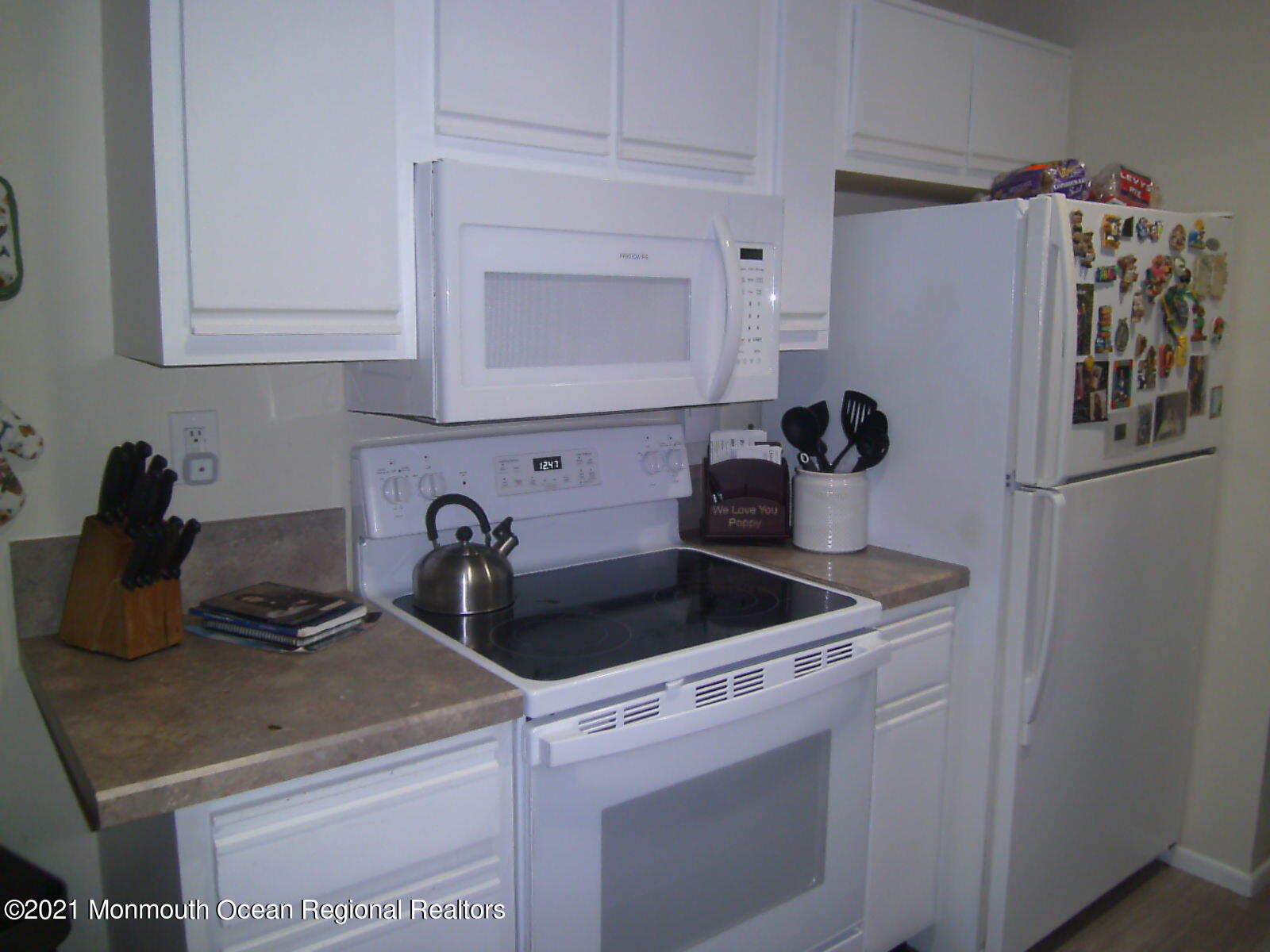 41 Meadow Green Circle, Unit E Manalapan, NJ 07726 - Photo 2 of 9 a kitchen with appliances and cabinets