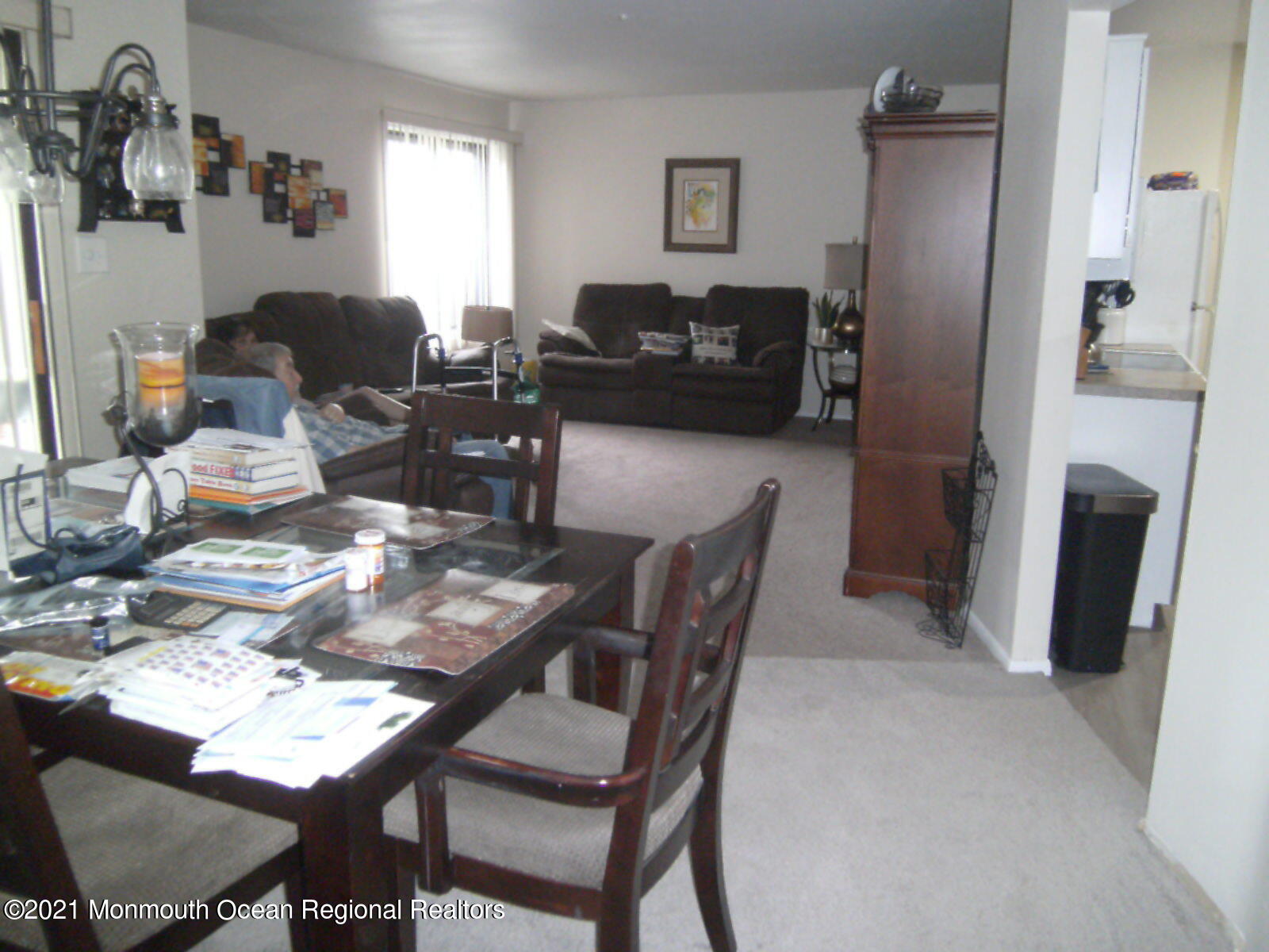 41 Meadow Green Circle, Unit E Manalapan, NJ 07726 - Photo 5 of 9 a view of a livingroom with furniture and a window