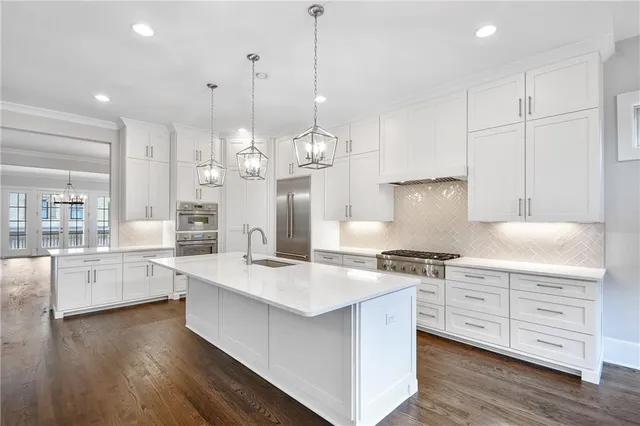 an empty room with a window and ceiling fan