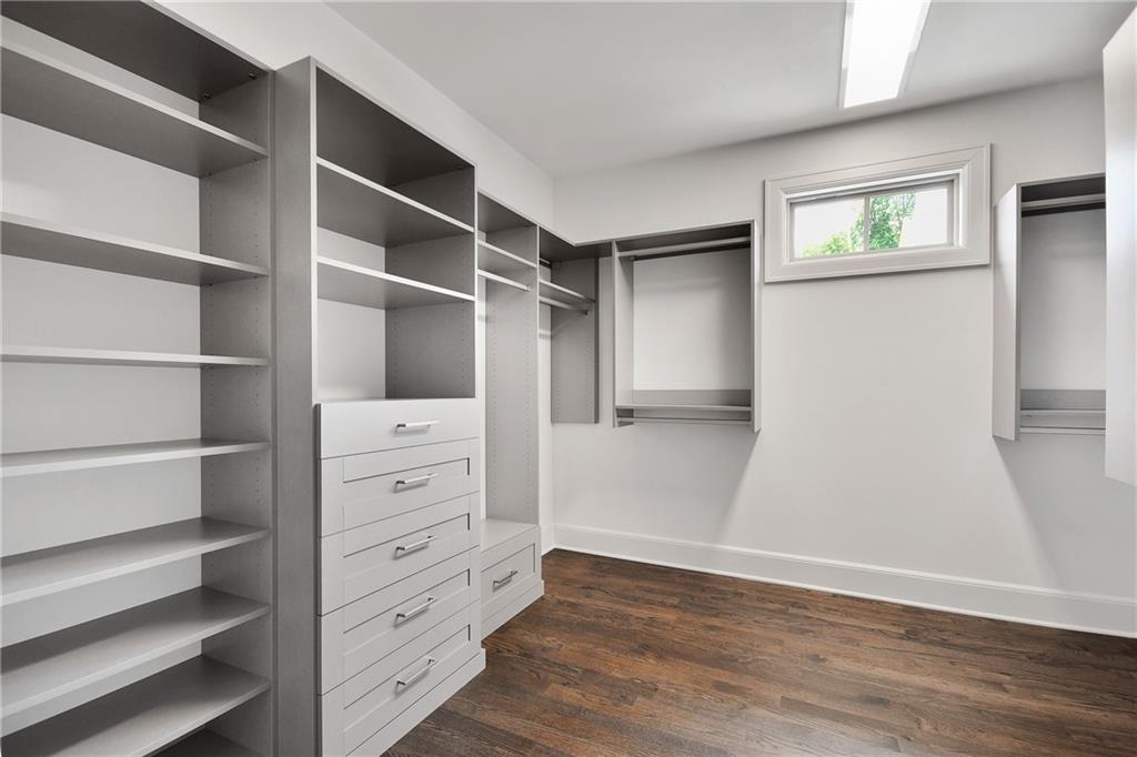 3520 Vermillion View Suwanee, GA 30024 - Photo 23 of 45 a view of walk in closet with empty racks