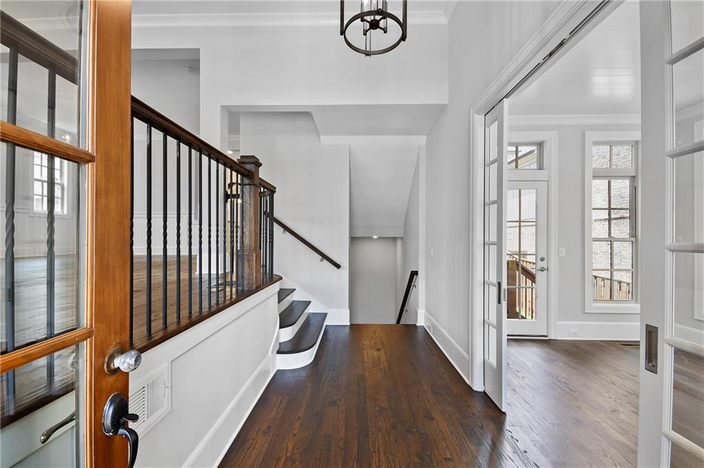 3520 Vermillion View Suwanee, GA 30024 - Photo 7 of 45 a view of an entryway with wooden floor and door