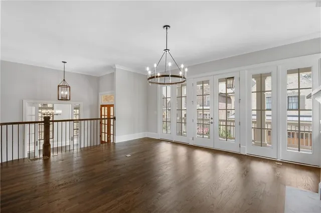 a spacious bathroom with a sink double vanity granite and a mirror