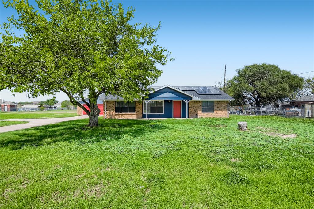 7744 Nine Mile Bridge Road Fort Worth, TX 76135 - Photo 1 of 1 a front view of a house with a yard