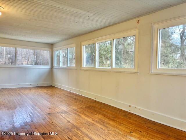 698 North Abington Road Clarks Summit, PA 18411 - Photo 22 of 36 an empty room with wooden floor and windows