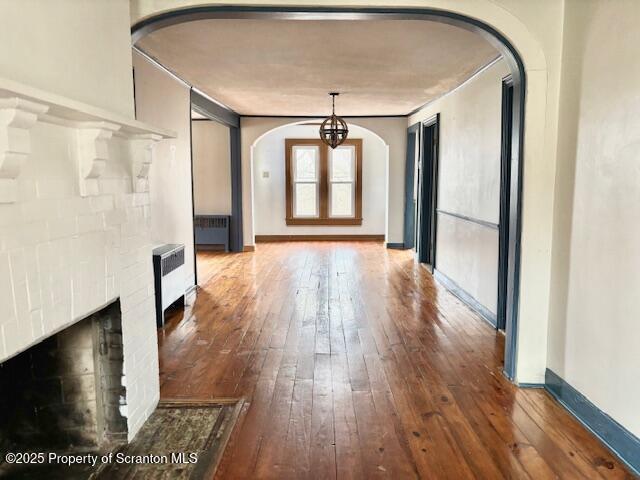 698 North Abington Road Clarks Summit, PA 18411 - Photo 27 of 36 a hallway with wooden floor chandelier and livingroom view