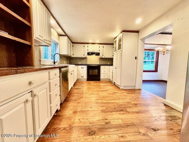 698 North Abington Road Clarks Summit, PA 18411 - Photo 5 of 36 a kitchen with granite countertop a refrigerator and a stove top oven
