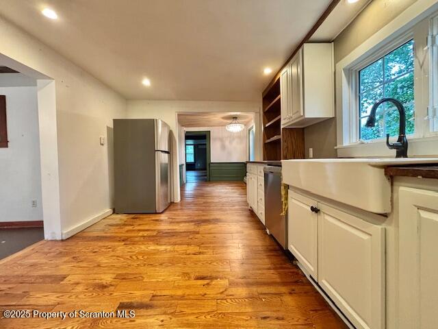 698 North Abington Road Clarks Summit, PA 18411 - Photo 6 of 36 a view of a kitchen with wooden floor and a window
